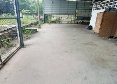 Spacious covered outdoor area with concrete flooring