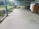 Spacious covered outdoor area with concrete flooring