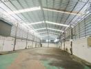 Spacious warehouse with high ceilings and ample lighting