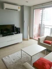 Modern living room with AC and balcony view