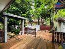 Spacious wooden deck in a lush garden setting