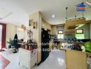 Spacious kitchen with modern appliances and adjacent dining area