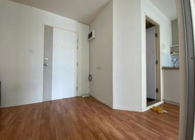 Entryway with view of kitchenette