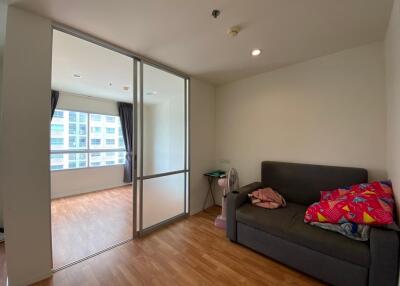 Living room with sliding glass doors separating from another room