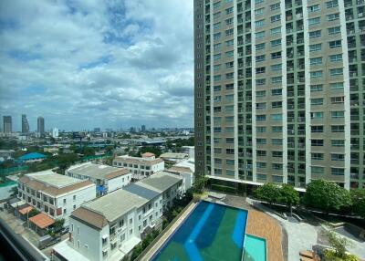 High-rise apartment building with swimming pool view