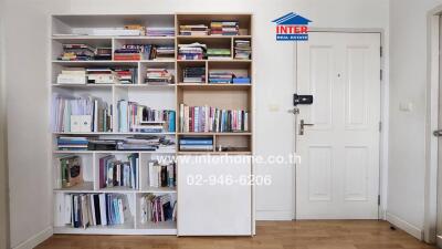 Bookshelf near the entrance door