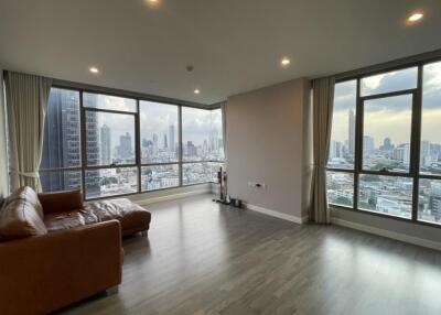 Spacious modern living room with panoramic city view