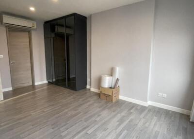 Minimalist bedroom with wardrobe and boxes