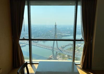 Dining room with a view of a bridge and river