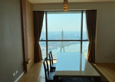 Dining room with a large window offering a scenic view