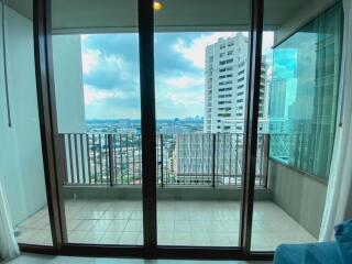 Spacious balcony with view of city buildings