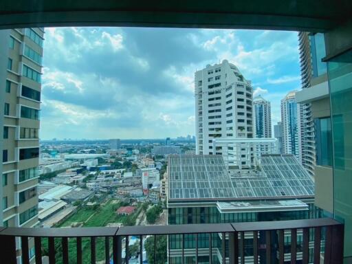 View from the balcony showcasing city skyline and surrounding buildings