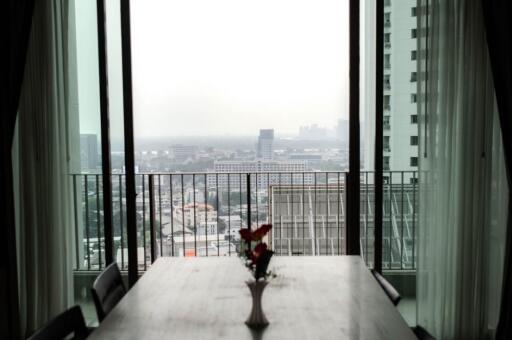 Dining table with city view from large windows