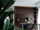 Modern dining area with dark wood shelving and table