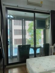 Bedroom with a view of the balcony through sliding glass doors