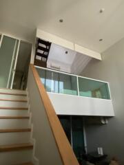 Modern living space with mezzanine and staircase