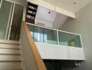 Modern living space with mezzanine and staircase