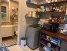 Utility room with shelves and appliances