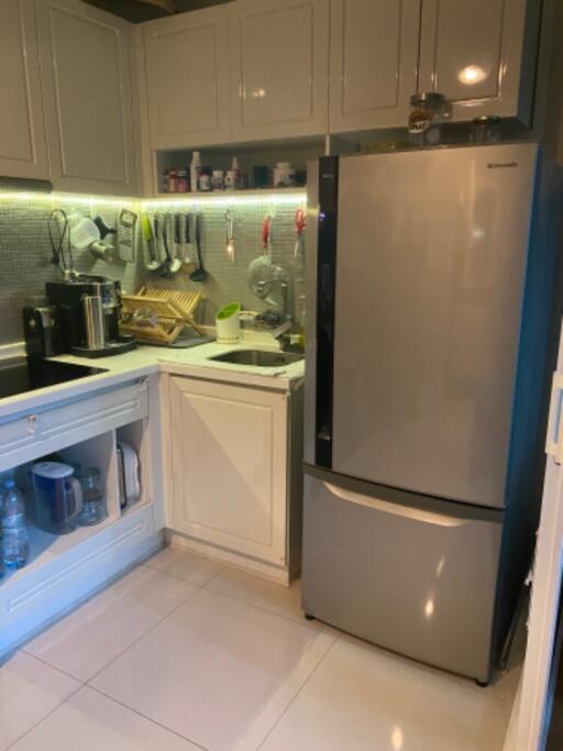 Modern kitchen with refrigerator and cabinets