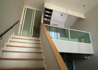 Two-story interior with stairs and loft space