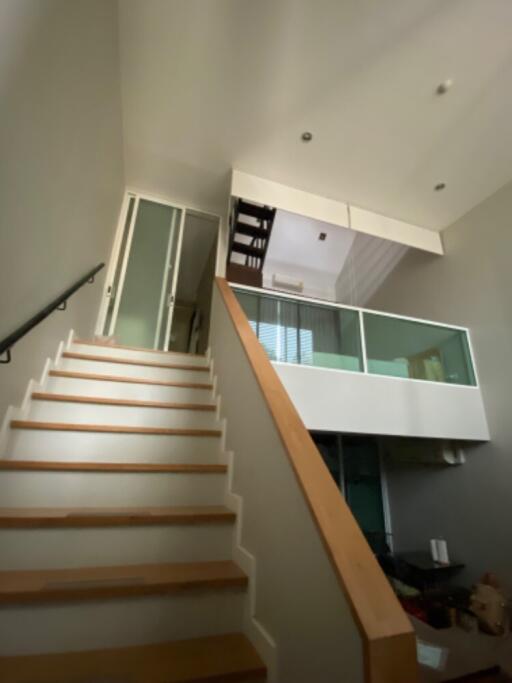 Two-story interior with stairs and loft space