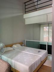 Bedroom with loft area and two beds