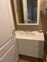 Small bathroom with sink and mirror