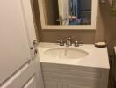 Small bathroom with sink and mirror