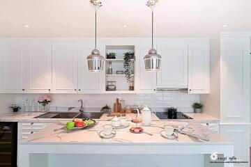 Modern kitchen with white cabinets and island