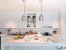 Modern kitchen with white cabinets and island