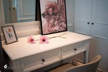 Stylish dresser with floral decor in a bedroom