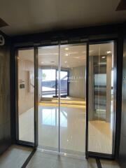 Main entrance with glass sliding doors