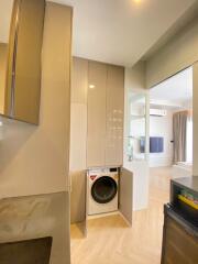 Compact laundry area with washing machine in a modern apartment