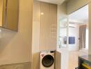 Compact laundry area with washing machine in a modern apartment