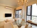 Modern living room with chandelier and city view