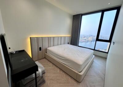 Modern bedroom with large window view