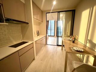 Modern kitchen with dining area and sliding glass door