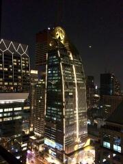 Night view of a modern skyscraper with illuminated lights