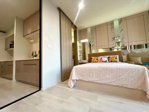 Modern bedroom with an adjacent kitchenette