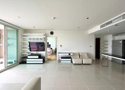 Spacious modern living room with TV and sectional sofa