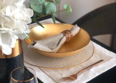 Stylish dining table setting with elegant gold accents