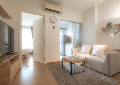 Living room with light colored furniture and modern decor