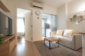 Living room with light colored furniture and modern decor