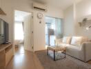 Living room with light colored furniture and modern decor