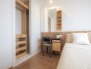 Modern bedroom with built-in wardrobe and workspace