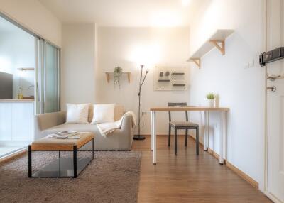 Modern living room with adjacent kitchen