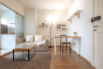 Modern living room with adjacent kitchen