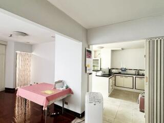 Modern kitchen with adjacent area in a home