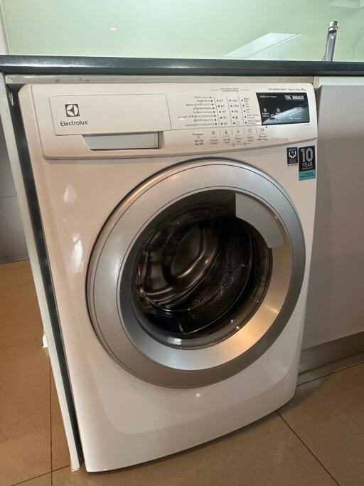 Washing machine in laundry area