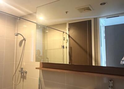 Modern bathroom with glass shower enclosure and vanity